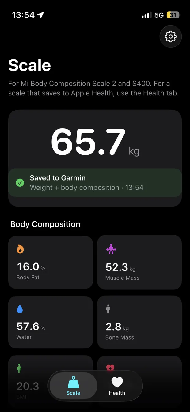 Scale Relay showing a 65.7 kilogram measurement saved to Garmin Connect with body fat, muscle mass, water and bone mass